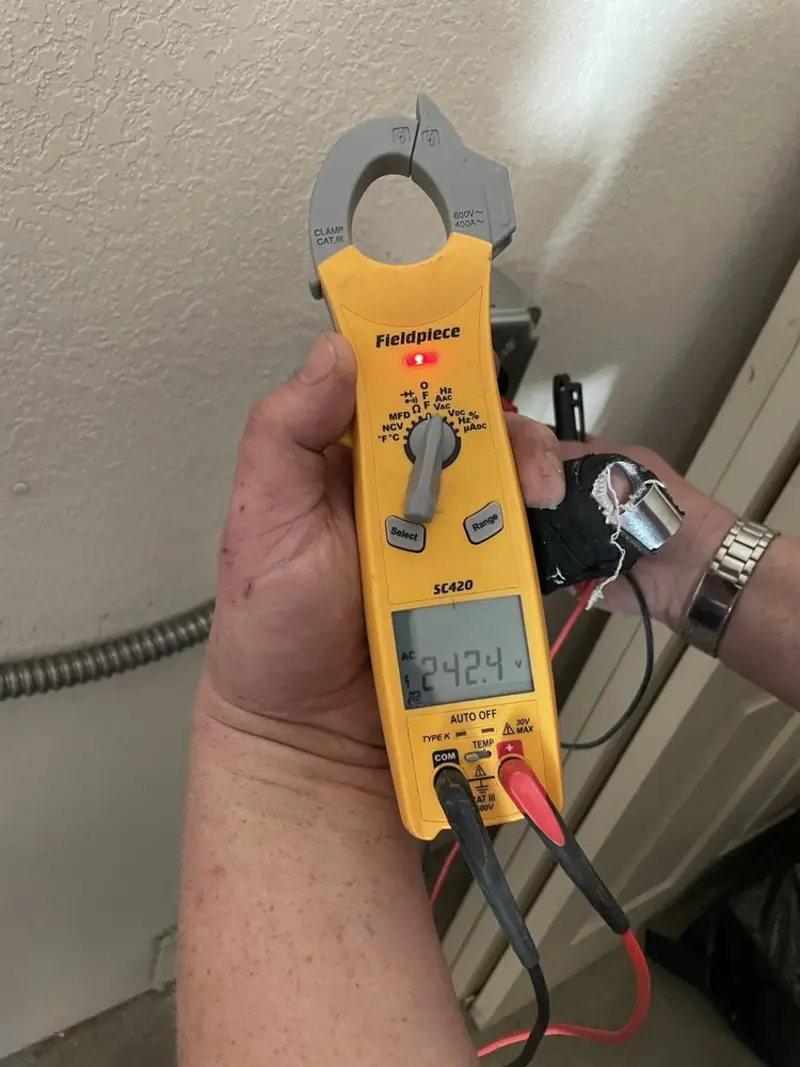 Voltage testing with clamp meter during Electrical Installation Services in Franklin